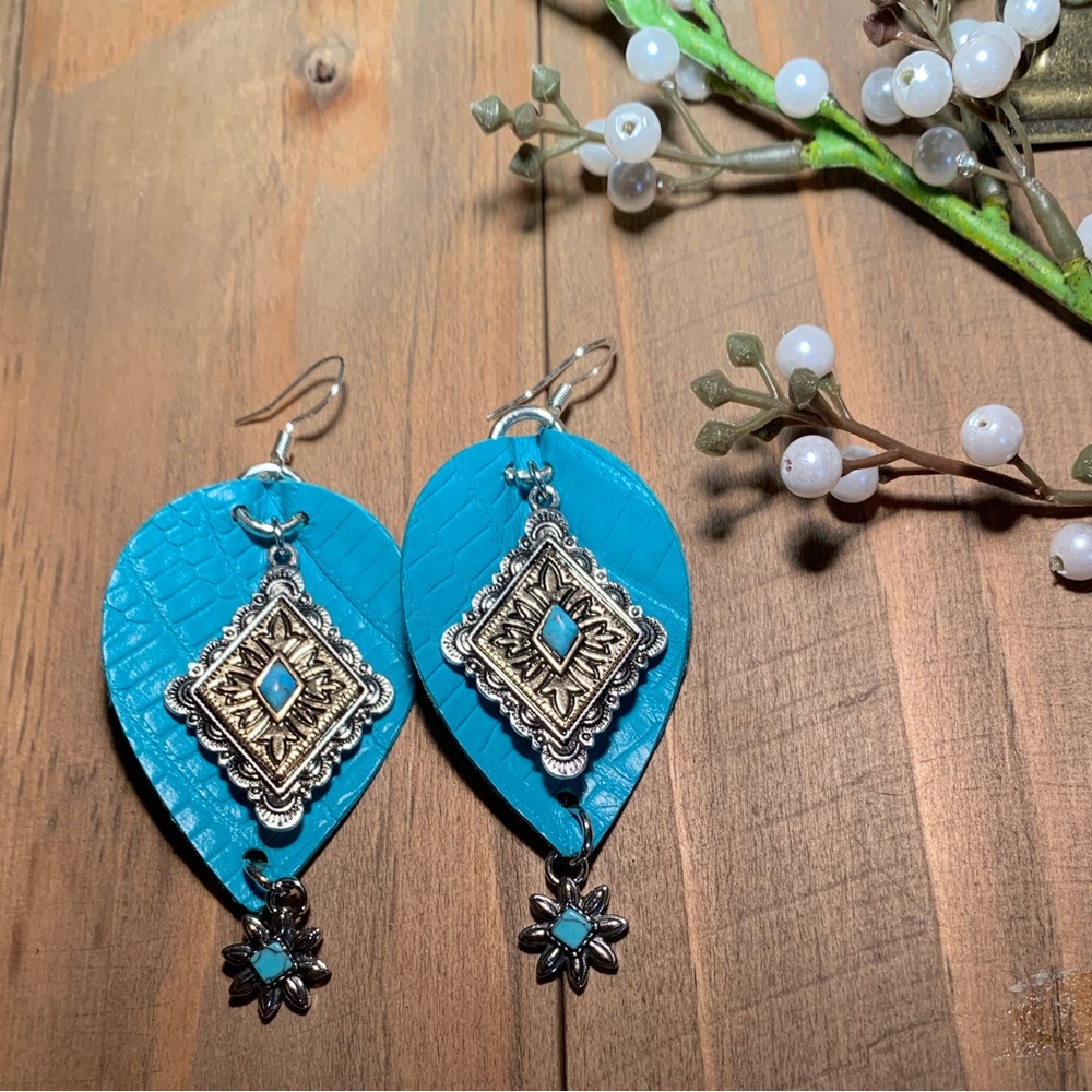 Turquoise lizard embossed earrings adorned with two tone accents